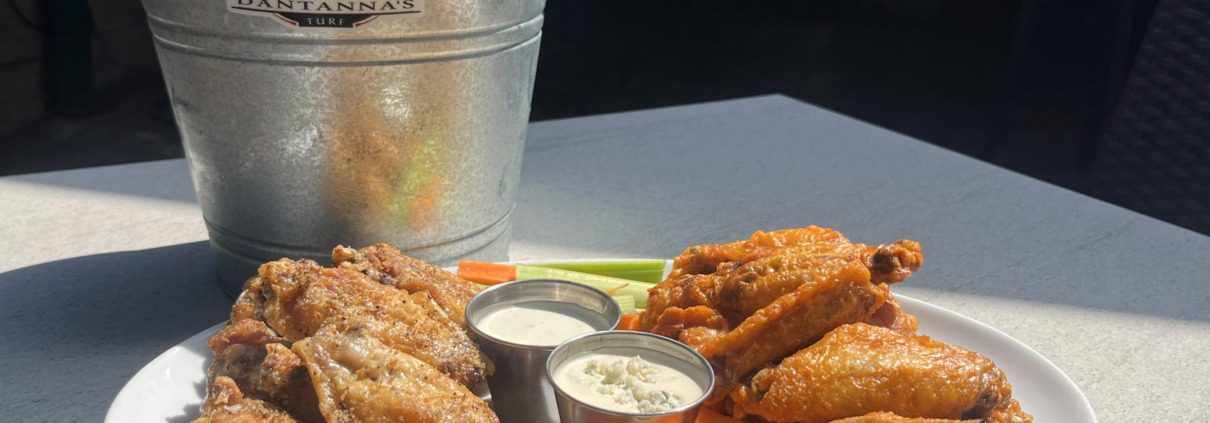 An ice cold bucket of beers with wings two-ways for Labor Day Weekend in Atlanta